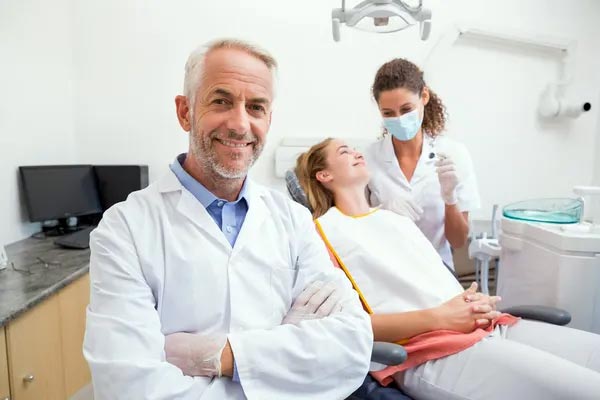 Experienced dentist smiling