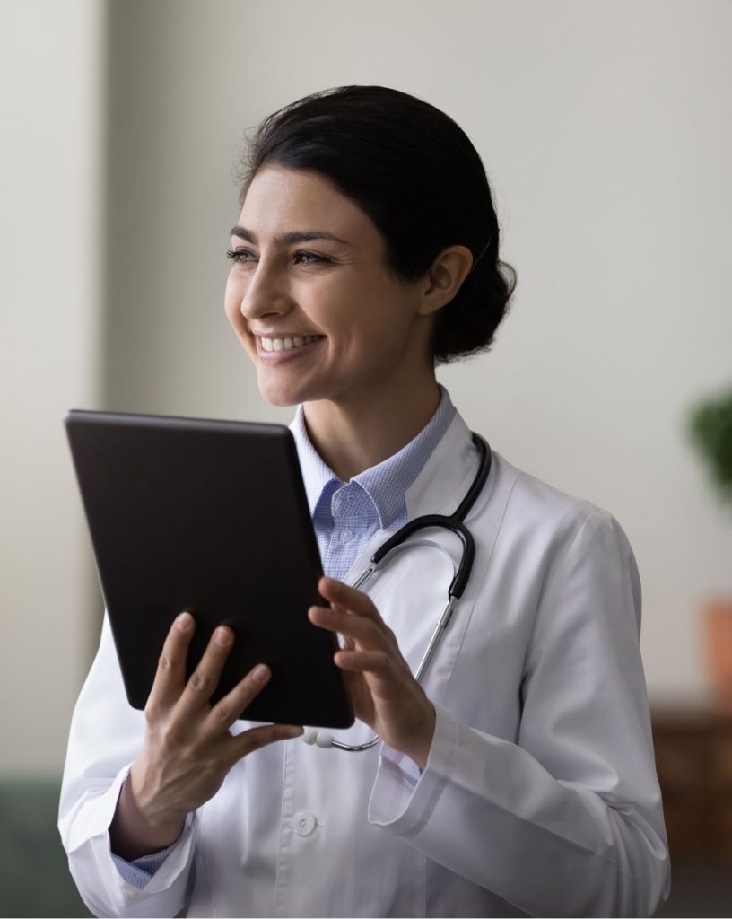 Female health professional holding tablet